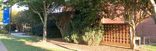 Patio area behind cruciform brick wall will become part of the building, allowing larger restrooms and a second large multipurpose room.