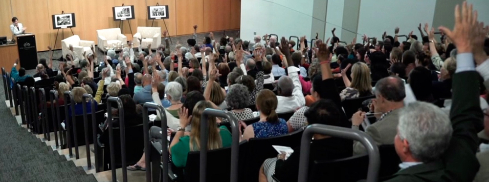 Audience members at UNCC Center City auditorium when asked to raise hands if they were education advocates.