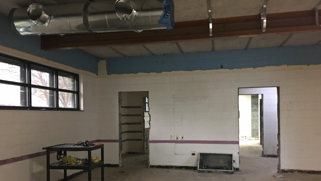 Looking from back of room where Forum met, through old kitchen to second meeting room. Kitchen plumbing has been removed. HVAC ductwork installation has begun on ceiling.