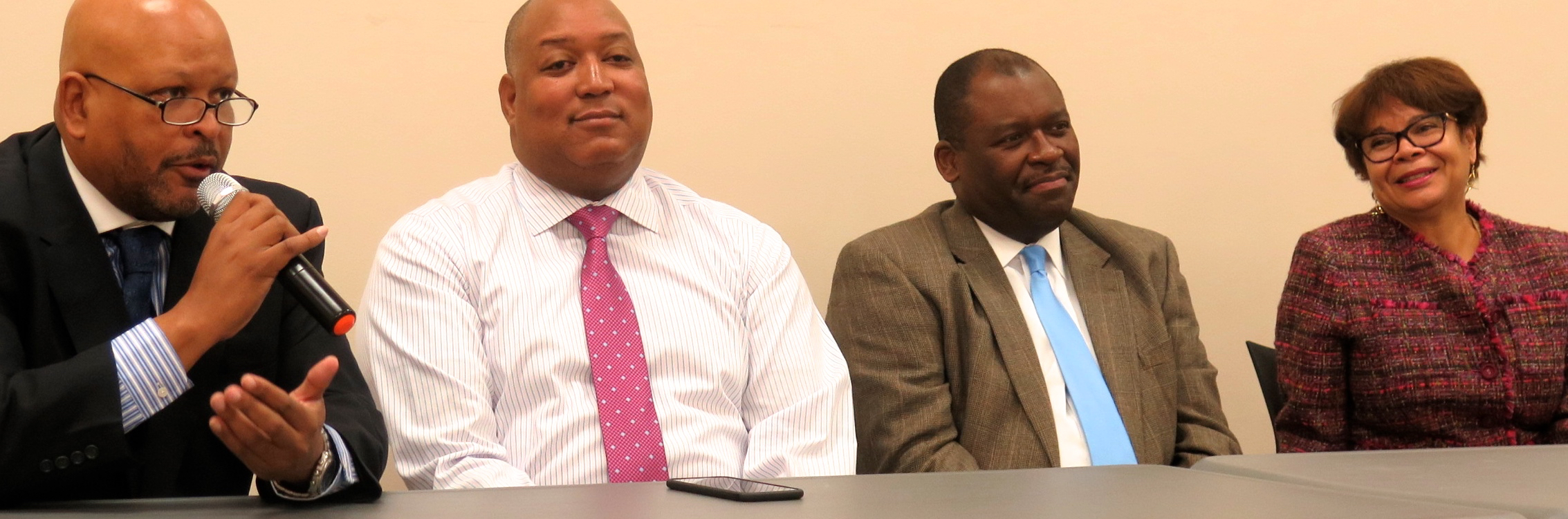 From left: N.C. Rep. Rodney Moore; N.C. Sen. Joel Ford; County Commissioner Trevor Fuller; and Charlotte Mayor Pro tem Vi Lyles.